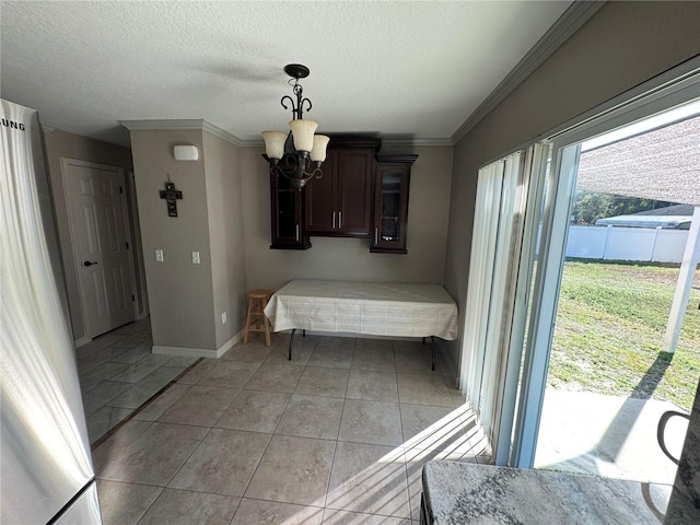 tiled bedroom featuring an inviting chandelier, ornamental molding, a textured ceiling, and access to outside