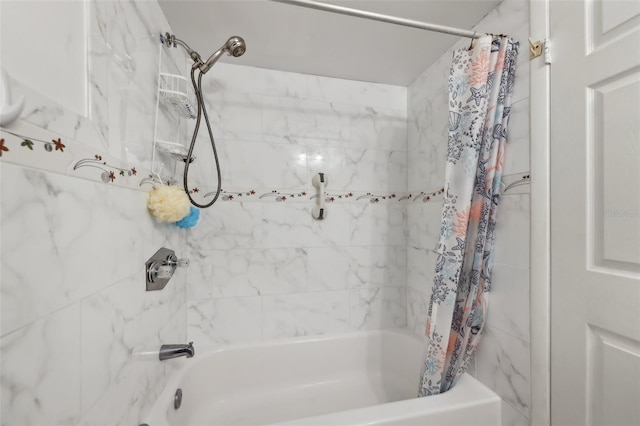 bathroom with shower / bath combo with shower curtain