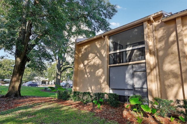 view of home's exterior featuring a lawn