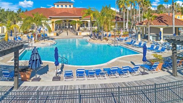 view of swimming pool with a patio area