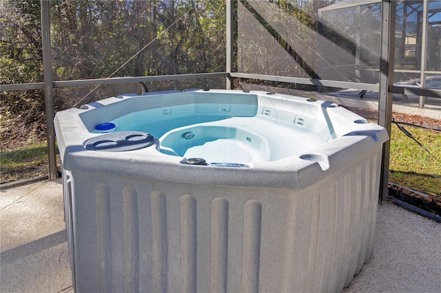 view of patio / terrace with a hot tub