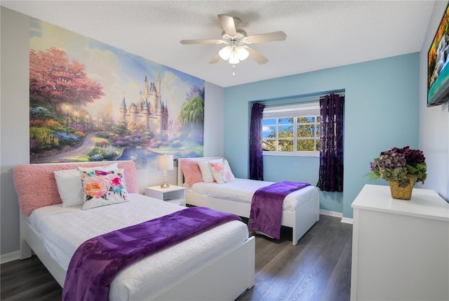 bedroom with dark hardwood / wood-style flooring, ceiling fan, and a textured ceiling