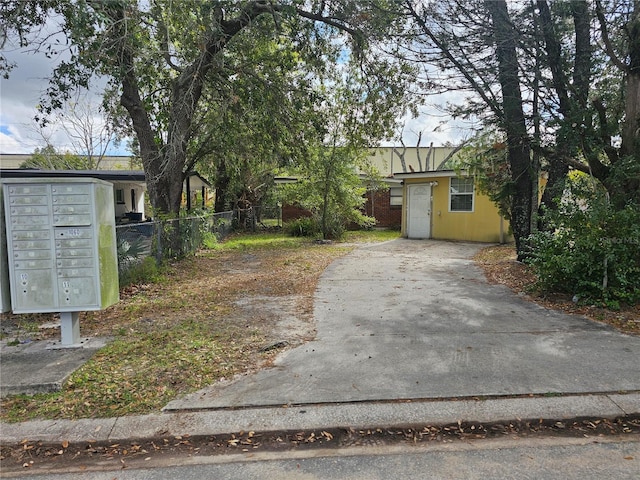 view of yard featuring a mail area