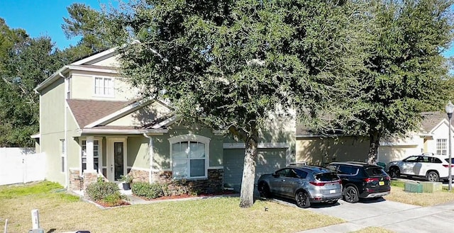 view of front facade with a garage and a front yard