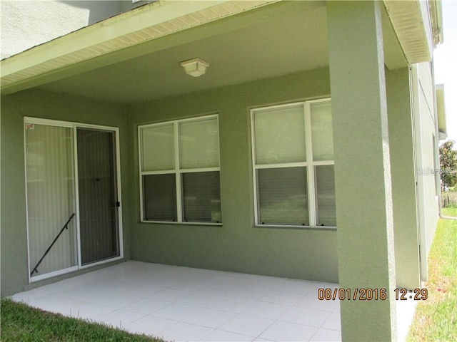 doorway to property featuring a patio