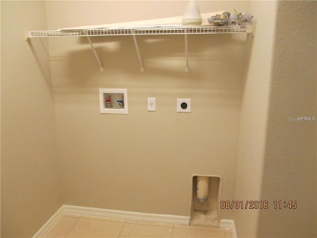 laundry area featuring hookup for a washing machine, tile patterned floors, and hookup for an electric dryer