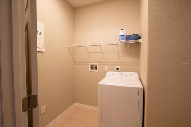 laundry room featuring washer / dryer and light tile patterned floors