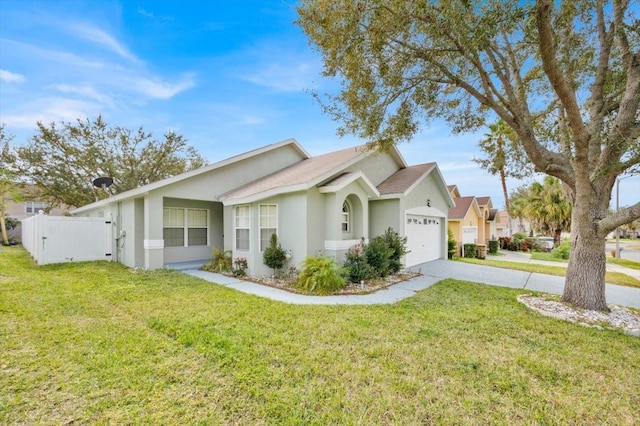 view of front of home with a garage and a front lawn