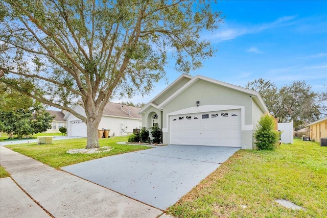 single story home with central AC, a garage, and a front lawn