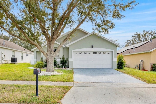 single story home with cooling unit, a garage, and a front yard