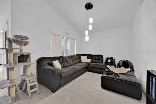 living room with high vaulted ceiling and a fireplace