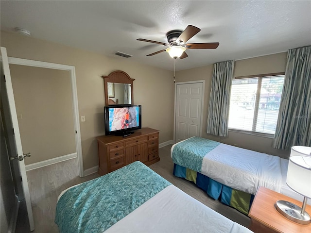 bedroom featuring ceiling fan and hardwood / wood-style floors