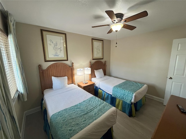 bedroom featuring hardwood / wood-style flooring and ceiling fan