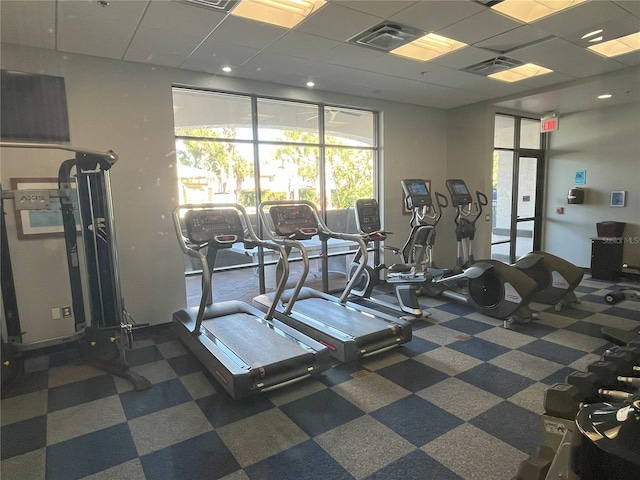 exercise room featuring a drop ceiling