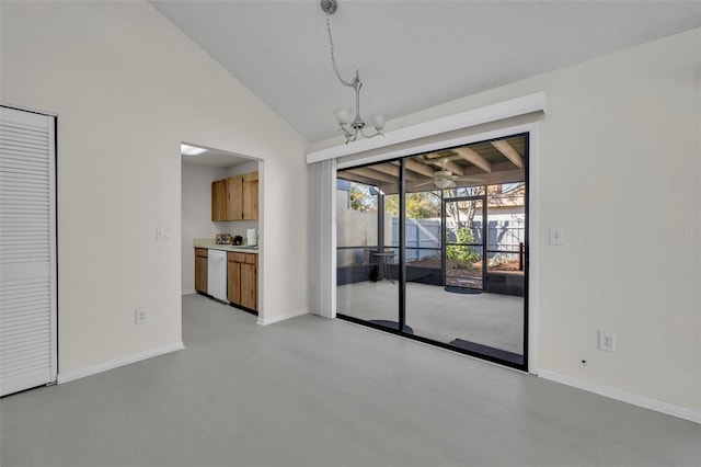 interior space with lofted ceiling and a chandelier