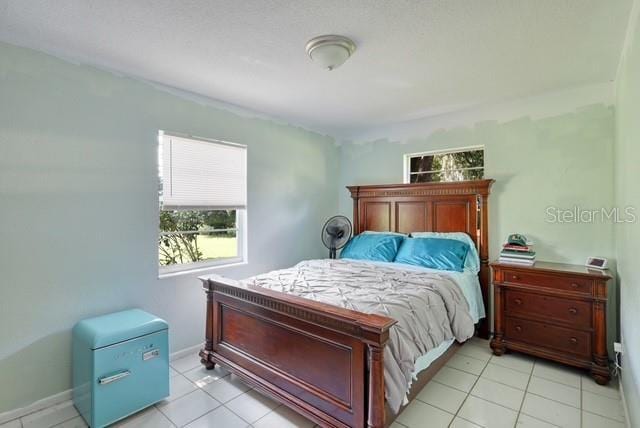 bedroom featuring light tile patterned floors