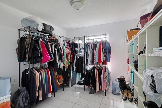 walk in closet featuring light tile patterned floors