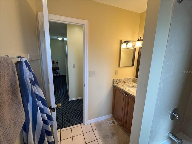 bathroom with vanity, tile patterned floors, and walk in shower