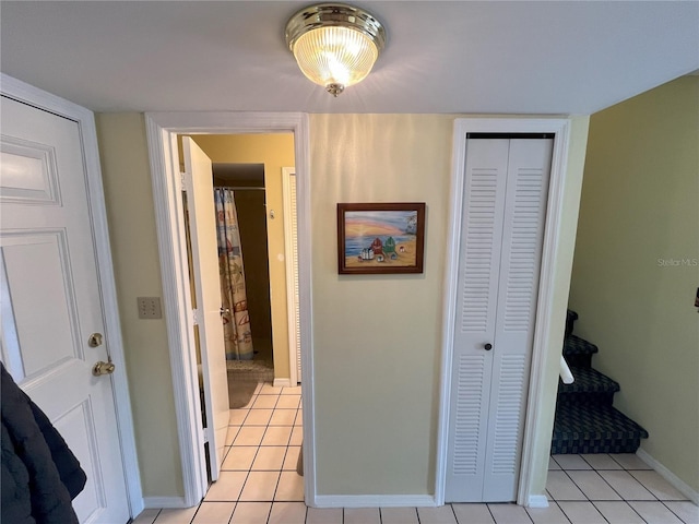 hallway featuring light tile patterned floors