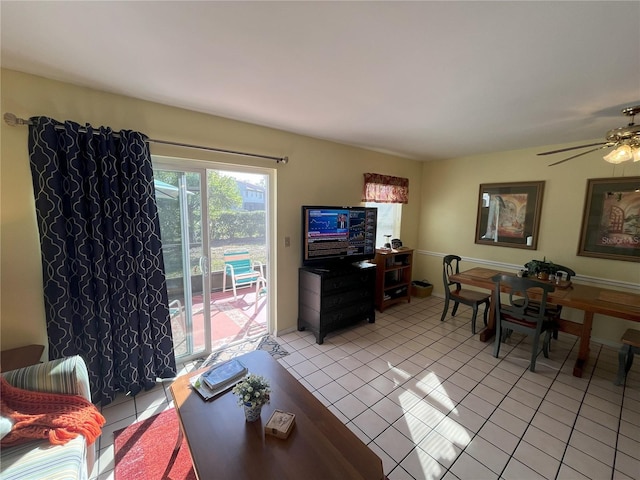 living room featuring ceiling fan and light tile patterned floors