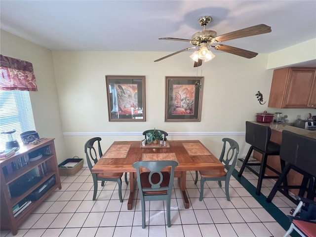 tiled dining room with ceiling fan