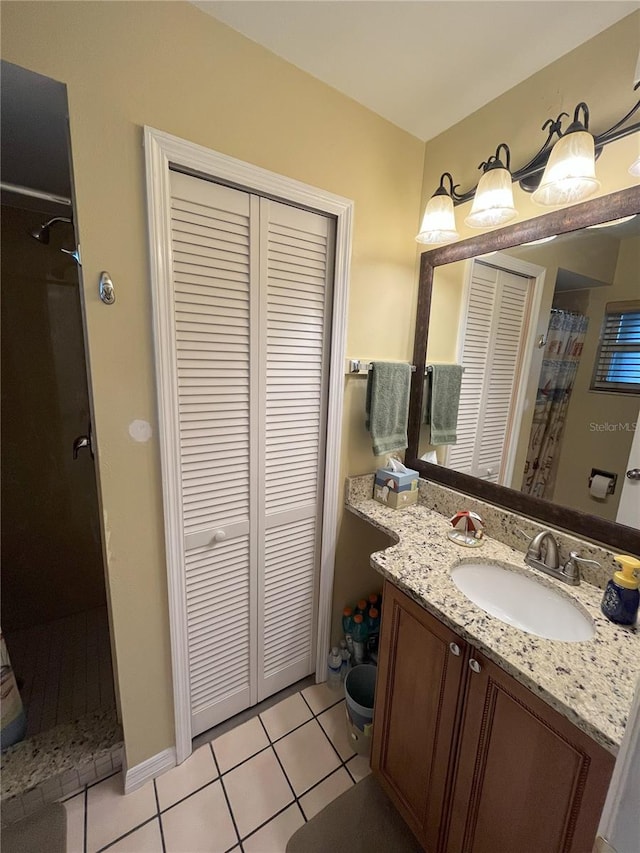 bathroom featuring vanity, tile patterned flooring, and a shower with shower curtain