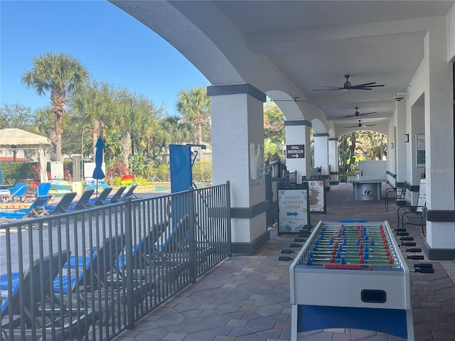 view of patio / terrace featuring ceiling fan