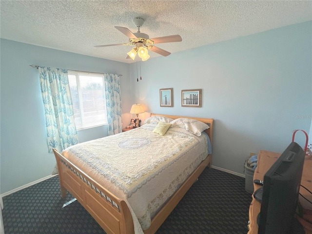 bedroom with carpet floors, ceiling fan, a textured ceiling, and baseboards