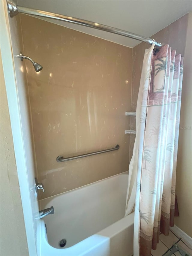 bathroom featuring shower / tub combo and tile patterned flooring
