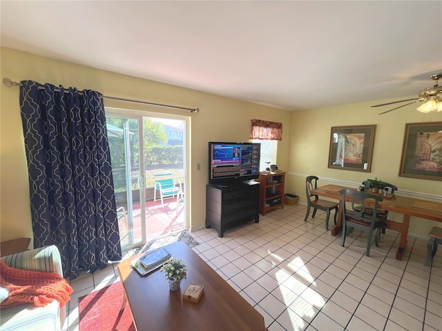 living area featuring a ceiling fan and light tile patterned flooring