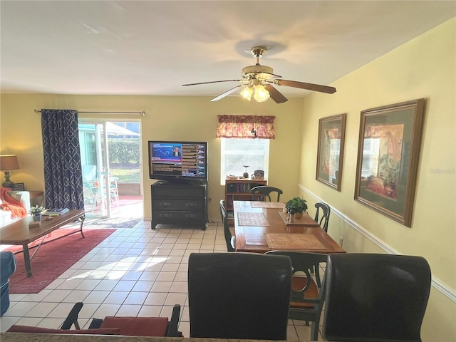 dining room with light tile patterned floors and a ceiling fan
