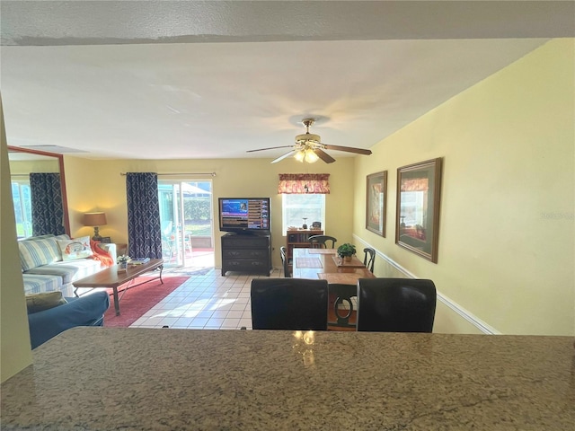 dining room featuring a ceiling fan and light tile patterned flooring