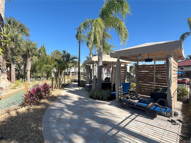 view of property's community featuring playground community and fence