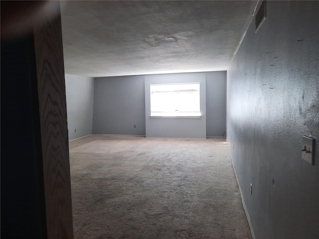 empty room with light colored carpet