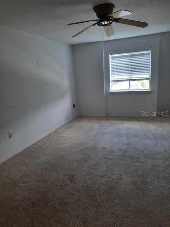 1928 Conway Rd Unit 40, Orlando, FL 32812 - unfurnished room featuring a ceiling fan and carpet floors