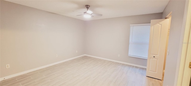 empty room featuring ceiling fan and light hardwood / wood-style flooring