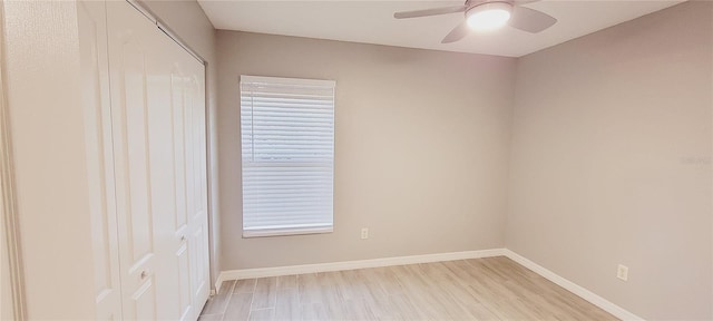 unfurnished room with ceiling fan and light wood-type flooring