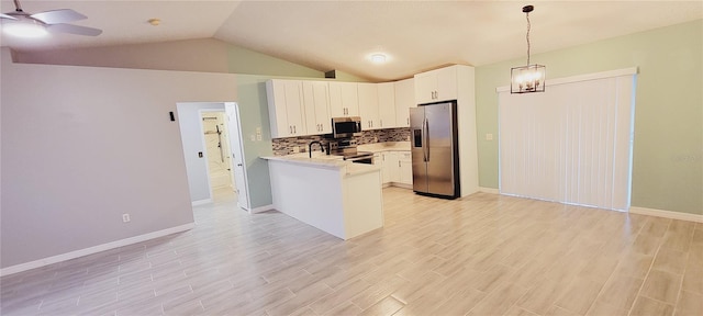 kitchen with white cabinetry, decorative backsplash, hanging light fixtures, kitchen peninsula, and stainless steel appliances