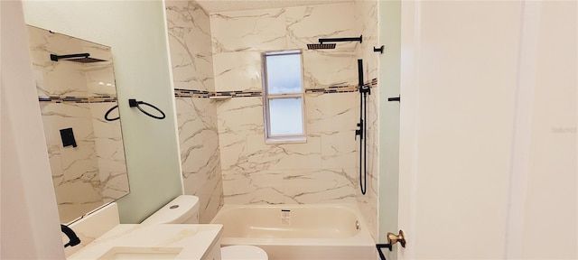 full bathroom featuring tiled shower / bath combo, vanity, and toilet