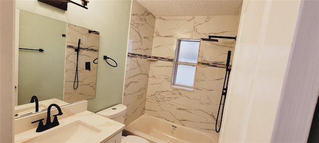 full bathroom featuring tiled shower / bath combo, vanity, a textured ceiling, and toilet