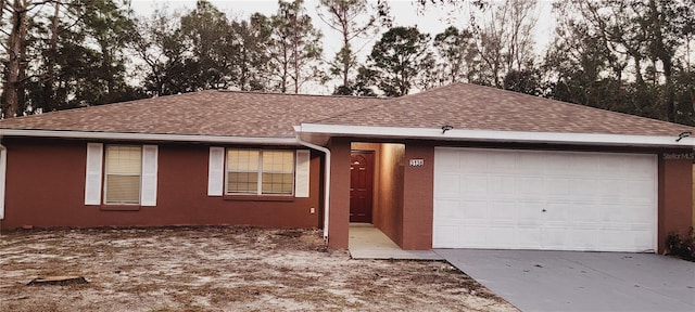 ranch-style house featuring a garage