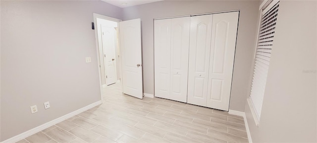 unfurnished bedroom featuring a closet