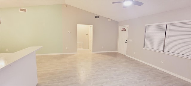 spare room with lofted ceiling and ceiling fan