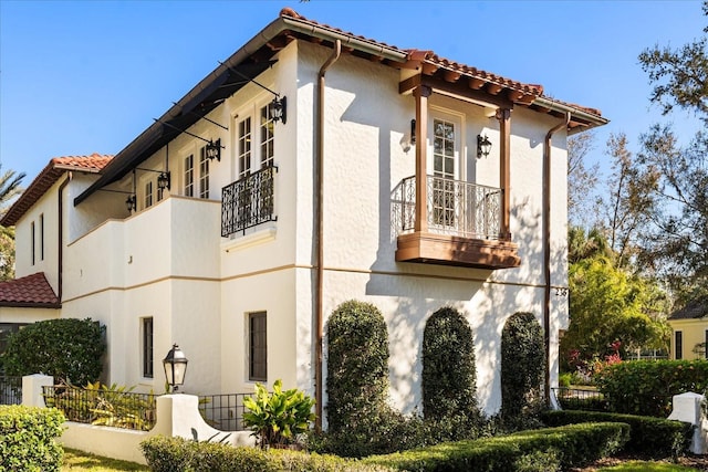 view of property exterior with a balcony