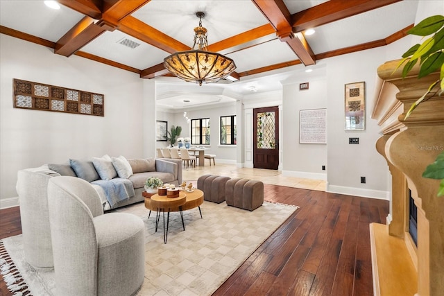 living room with beamed ceiling, wood-type flooring, and coffered ceiling