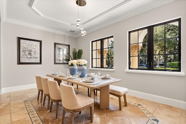 dining area featuring crown molding and a textured ceiling