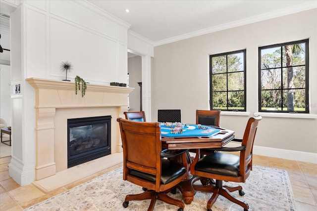 tiled dining area featuring crown molding and a high end fireplace