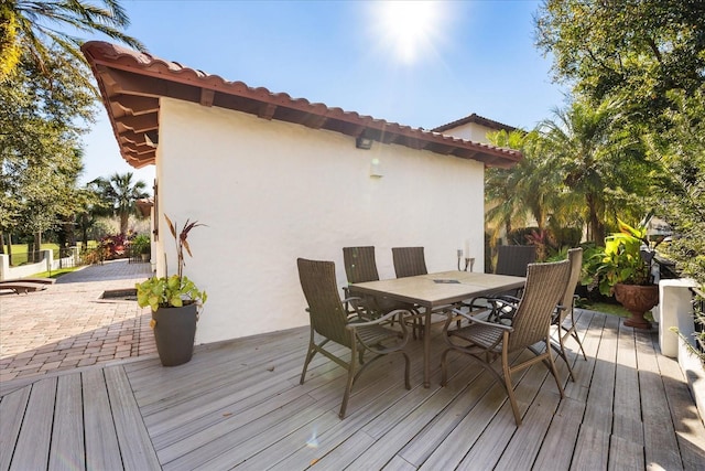 wooden deck with a patio area