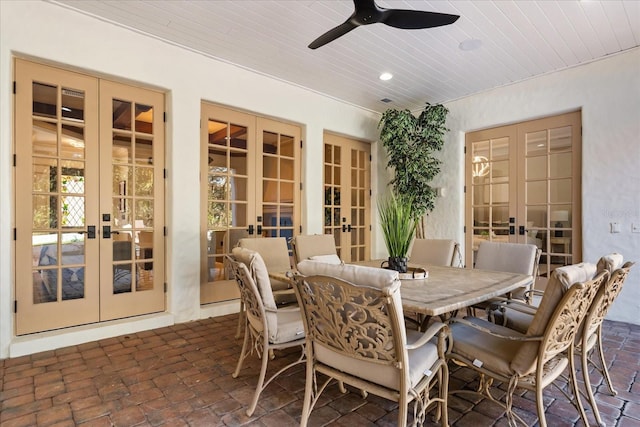 dining room featuring wood ceiling, french doors, and ceiling fan