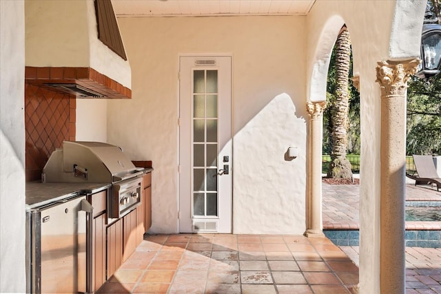 view of patio / terrace featuring an outdoor kitchen and grilling area